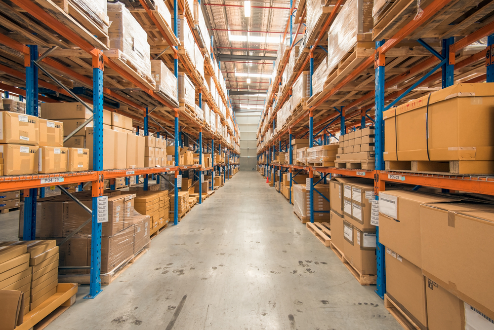 View of warehouse aisle showing palletized inventory on racking systems