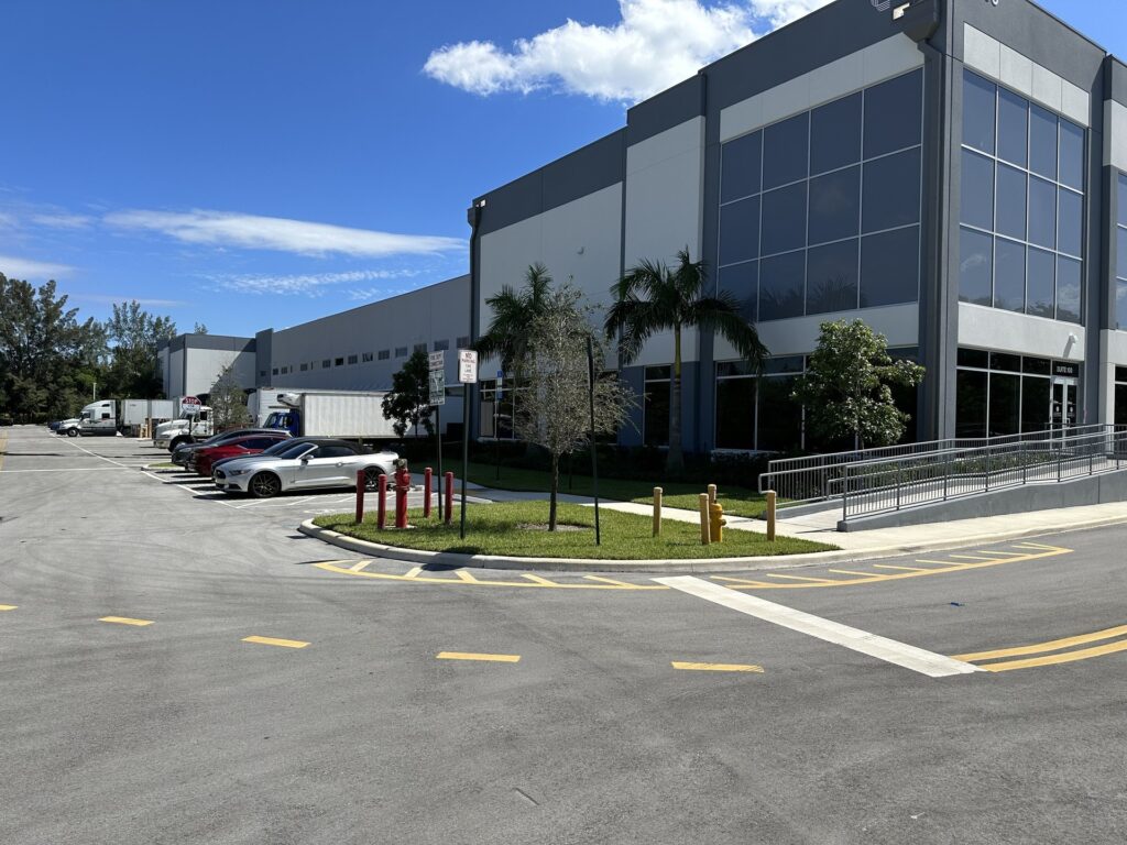 Front entrance of Challenge Warehousing & Accurate Trailers building, a 82,000 SF facility in Port Everglades, FL, showcasing the location's logistics services